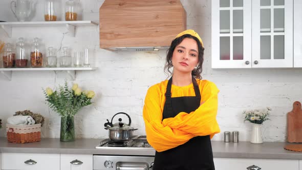 Portrait Serious Housewife Crossing Hands Looking Camera in Home Modern Kitchen alt