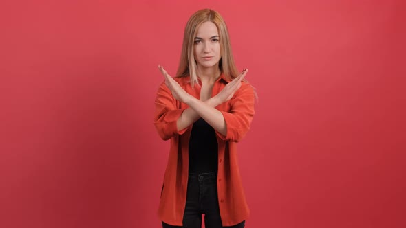 Young Woman Making Stop Gesture Crossing Her Hands alt