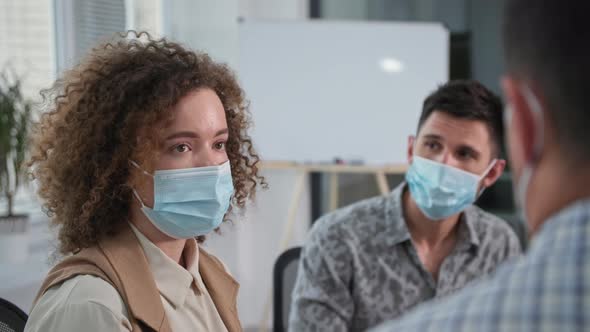 Portrait of a Young Woman Wearing a Medical Mask to Protect Against Virus and Infection Tells Her alt