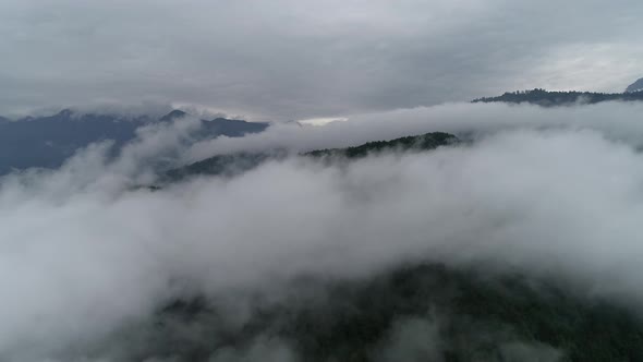 Drone Flying Near The Clouds Above The Mountains