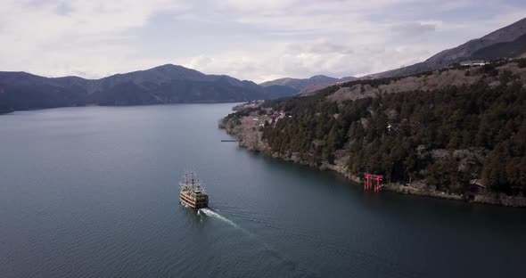 Drone Footage of a Pirate Boat Cruising on a Volcanic Lake Ashi Hakone Japan alt