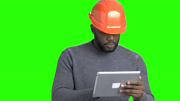 Afro American Engineer Working on Digital Tablet. alt
