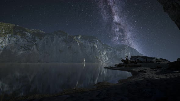 Hyperlapse of Night Starry Sky with Mountain and Ocean Beach in Lofoten Norway alt