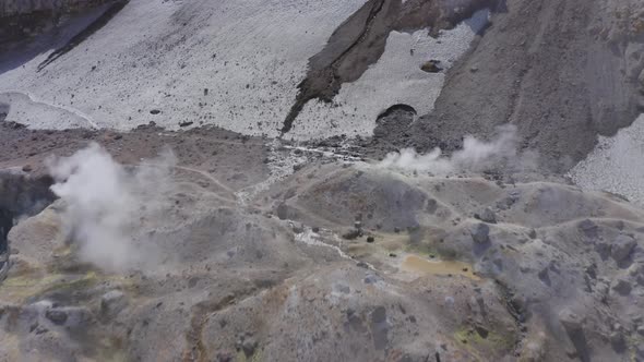 Aerial Drone Footage of Mutnovsky Volcano Crater with Fumaroles and Glacier