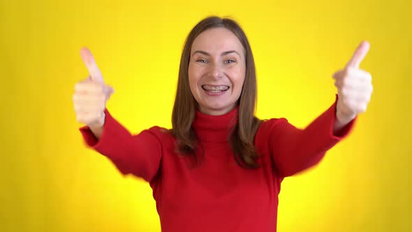 Handsome Smiling Woman Isolated on Yellow Background in Studio alt