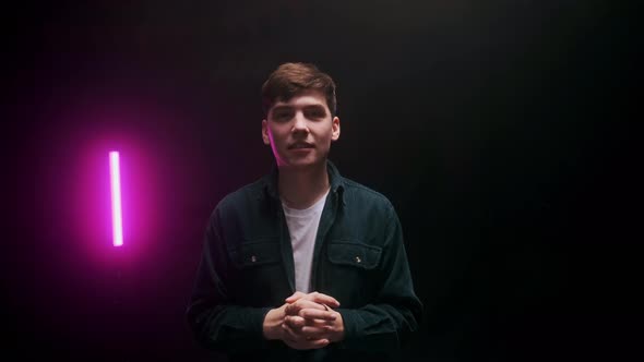 A Young Guy Shoots a Blog in a Black Studio alt