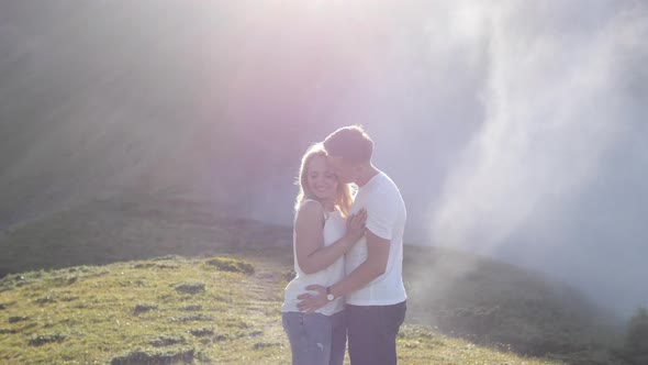 Young couple embracing alt