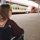 Lonely Young Caucasian Woman in the Wheelchair on the Train Station - VideoHive Item for Sale