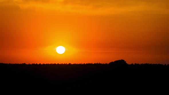 Sunset in the Yellow Sky. Timelapse. Big Bright Yellow Sun Moves Down alt