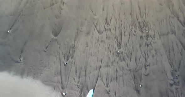 A surf desk left on the sand / 95 4K