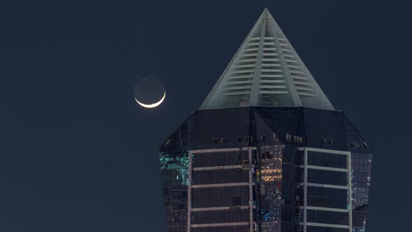 Nighttime View of Lights From Skyscrapers at Evening in Dubai Aerial Timelapse alt