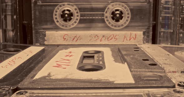 Vintage cassette and player. Player with spinning audio cassette. alt