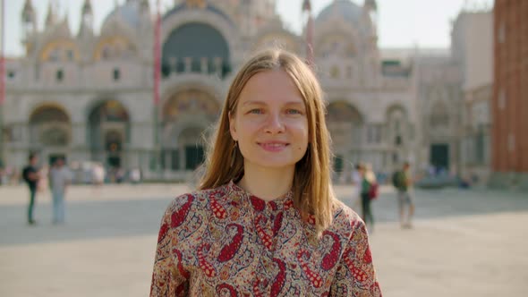 Portrait of Confident Happy Woman Walking in Venice on Piazza San Marco Italy