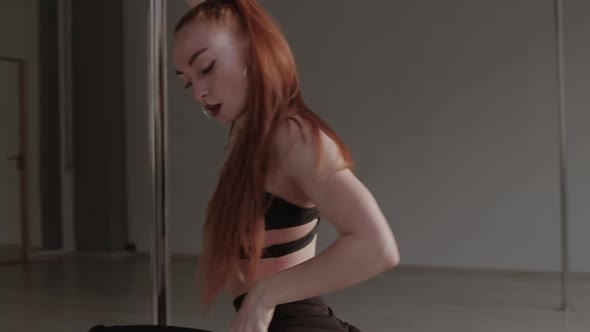 Fit Woman Dancing Erotic Dance in Studio alt