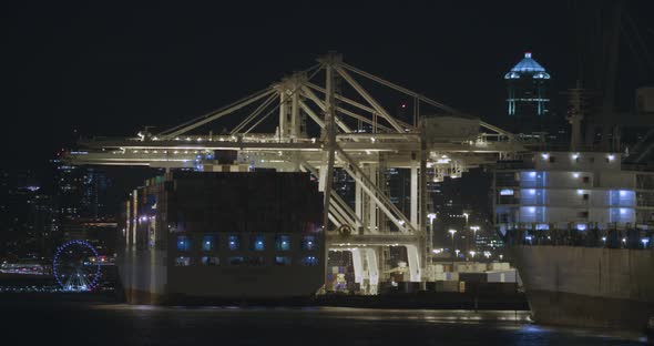 Shipping Freighter Loading Goods Off Semi Trucks Time Lapse Night Port Seattle Harbor Island alt