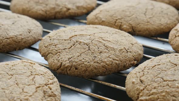 Fresh baked cookie surface close-up 4K 2160p 30fps UltraHD tilting footage - Healthy bread product o alt