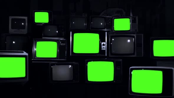 Pile of Retro TVs Green Screen on Dark Background. Black and White Tone ...
