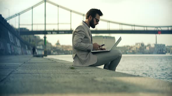 Man Sitting And Typing On Laptop. Businessman Remote Working In Internet Distance Job. alt