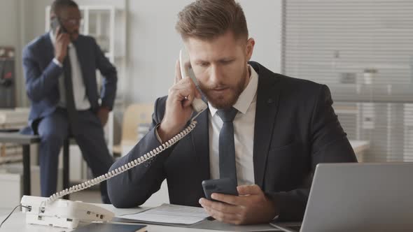 Multiethnic Brokers Talking with Investors on Phone alt