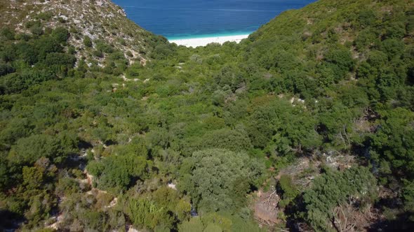 Stunning view of Fteri beach in hidden bay. Kefalonia, Greece. Surrounded by mediterranean vegetatio alt
