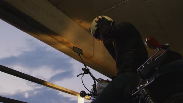 Man taking off his helmet alt