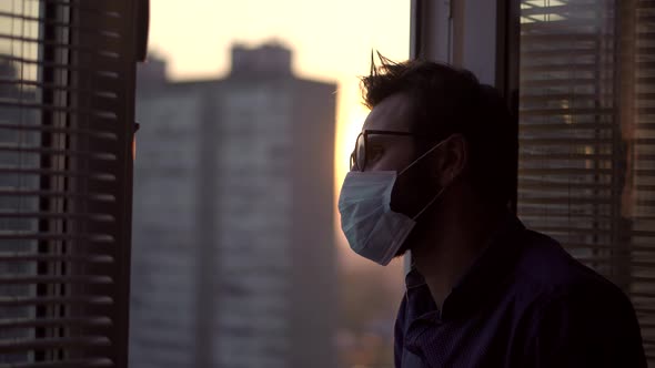 Sad Man In Face Mask Lockdown.Man In Face Mask In Quarantine Self Isolation Covid19 Coronavirus alt