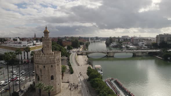 Tower of Gold or Torre del Oro and Guadalquivir river, Seville in Spain. Aerial forward