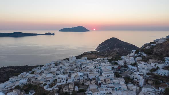 Aerial Hyper Lapse Moving Time Lapse Above Typicall Greek Village at Sunset on Milos, Greece Island alt