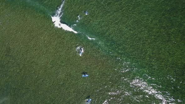 A View From Above of the Surfers in the Ocean