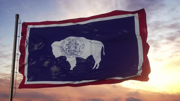 Flag of Wyoming Waving in the Wind Against Deep Beautiful Sky at Sunset alt