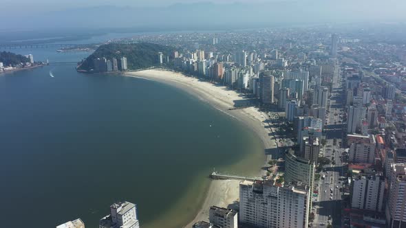 Panning wide landscape of coast city of Sao Vicente state of Sao Paulo Brazil. alt