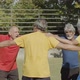 Cheerful Elderly Football Players Jumping in Circle Outside - VideoHive Item for Sale