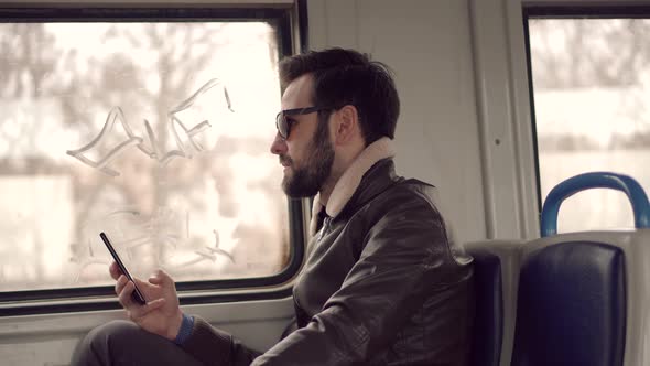 Businessman Chatting On Mobile Phone With Friend Sending Message On Social Network. alt