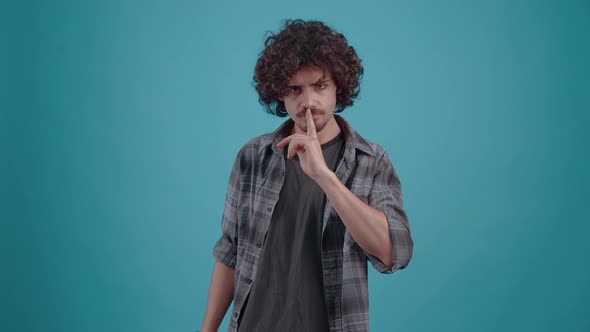 Young Hipster with His Finger on His Lips He Looks Silent Indisposed to Too Much Discussion alt