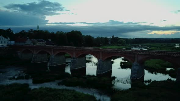 Widest Waterfall in Europe in Latvia Kuldiga and Brick Bridge Across the River Venta  alt
