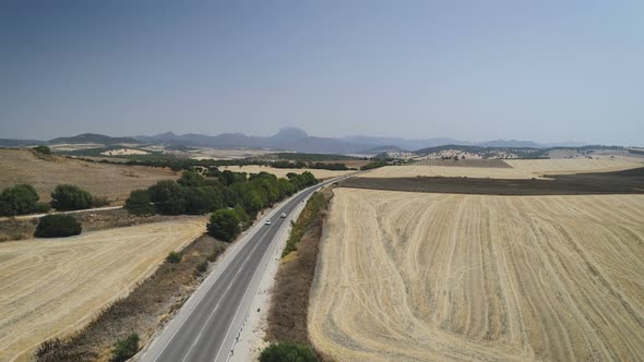 Aerial View Of Car Driving On Road In Summer Landscape