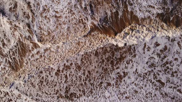 Aerial Birds Eye View Over Rough Sea Waves Breaking At Katwijk aan Zee. Slow Motion alt