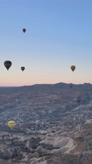 Vertical Video of Hot Air Balloons Flying in the Sky Over Cappadocia Turkey alt