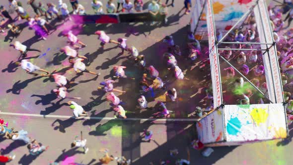 People at the Start To Run Colorful Marathon. Holi Race. Aerial View From Above alt
