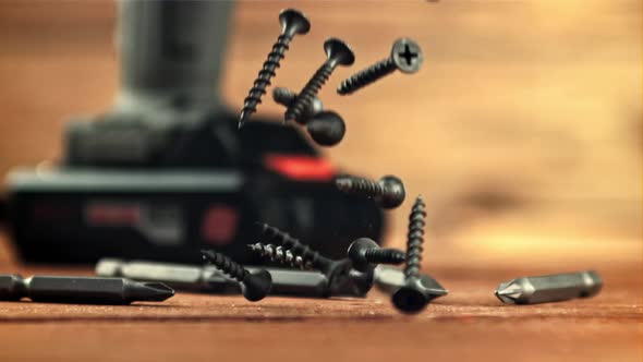 Selftapping Screws Fall on a Wooden Table alt