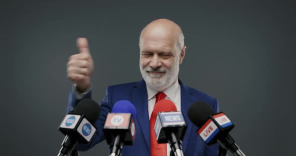Cheerful politician celebrating his success and giving a speech to the media