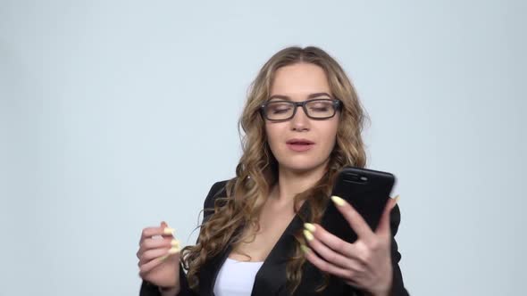 Pretty Girl Makes Selfie on Mobile Phone Then Looking Photos, Slow Motion alt