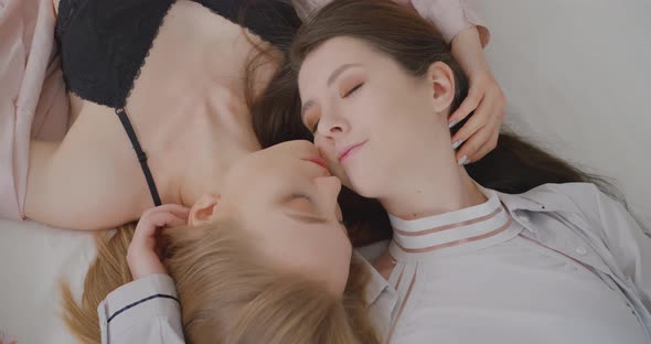 Two lesbians are relaxing in bed LGBTQ Gay Lesbian Bisexual Transgender Lesbian concept Love alt