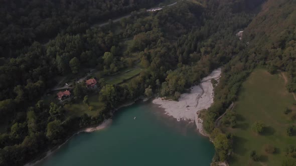 Aerial overview of Tenno Lake, Trentino, Italy. 4k alt