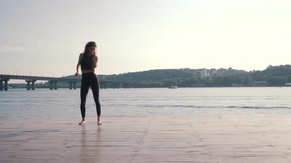 Sports Girl Dancing on the Pier