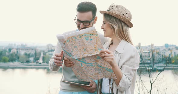 Beautiful Tourist Couple Traveling and Sightseeing Outdoor in City