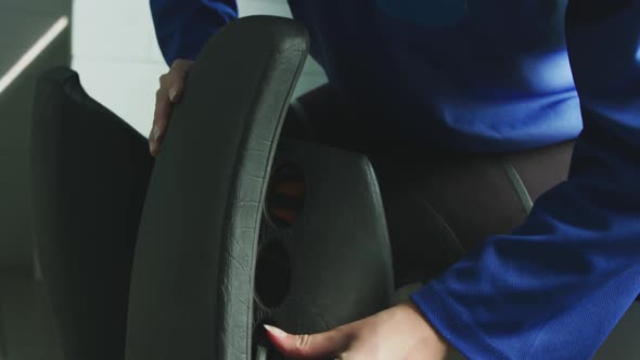 Female player tying her equipment in dressing room alt