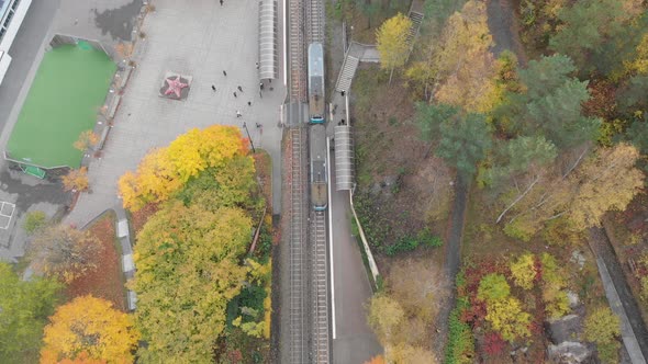 Top View Over Tram Driving in Autumn Aerial