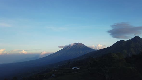 Agung mount at sunset 4K time lapse day to night clouds running over mountain volcano Bali Indonesia