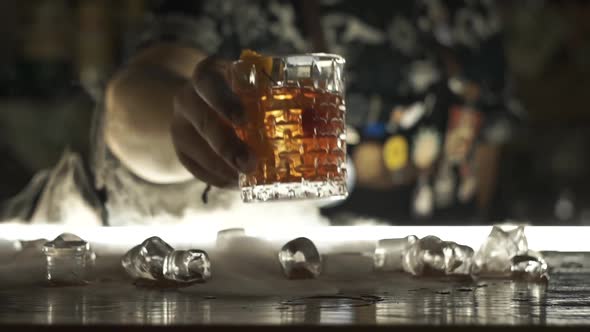 Bartender Serves Cocktail at Bar